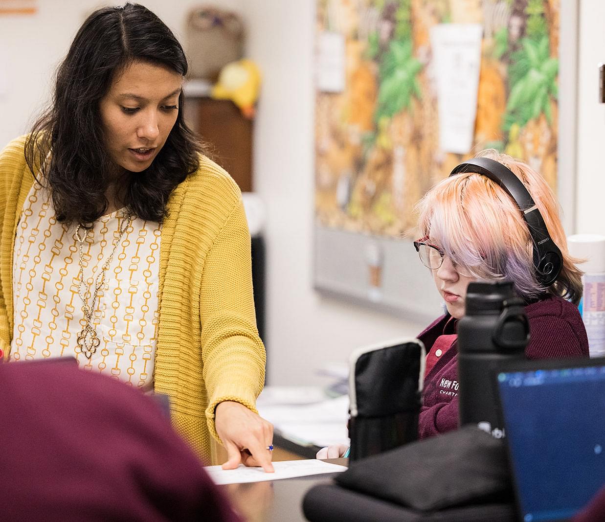 Young male student writing at desk