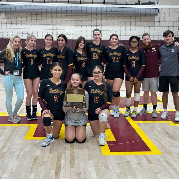  Female basketball team posing with trophies 
