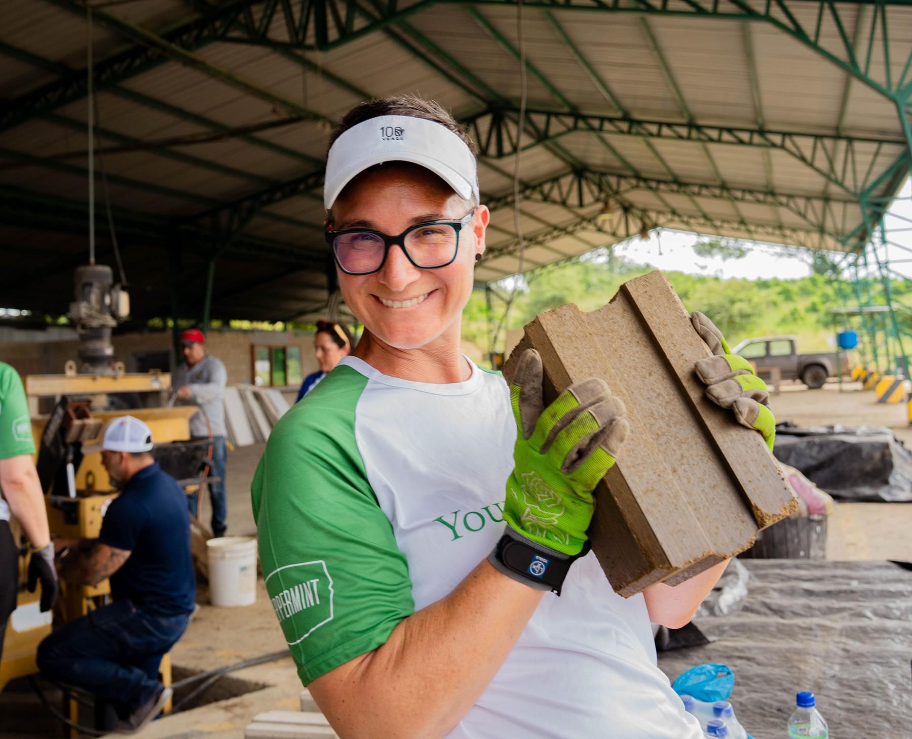 Young Living Foundation - Ecuador Service Trip - Female brand partners laying bricks