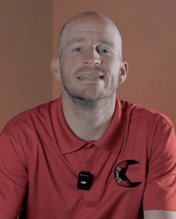 bald, white male with red polo shirt
