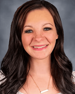 while female with brown hair headshot