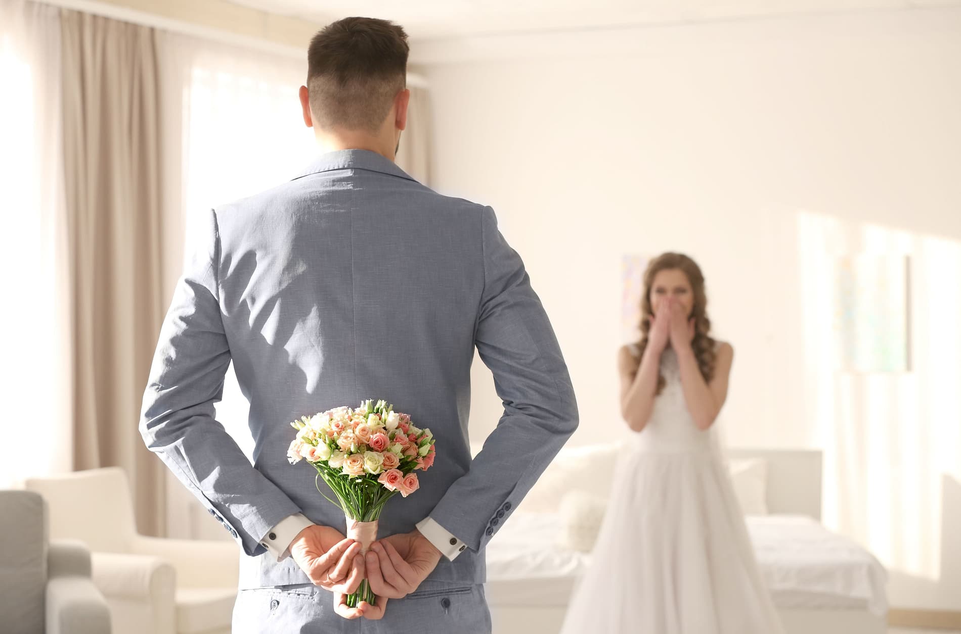 Bride and groom see each other for the first time on their wedding day