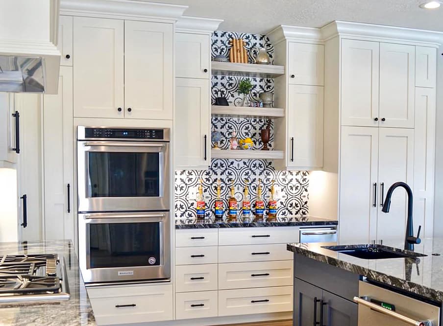 Kitchen with double oven and tile back splash