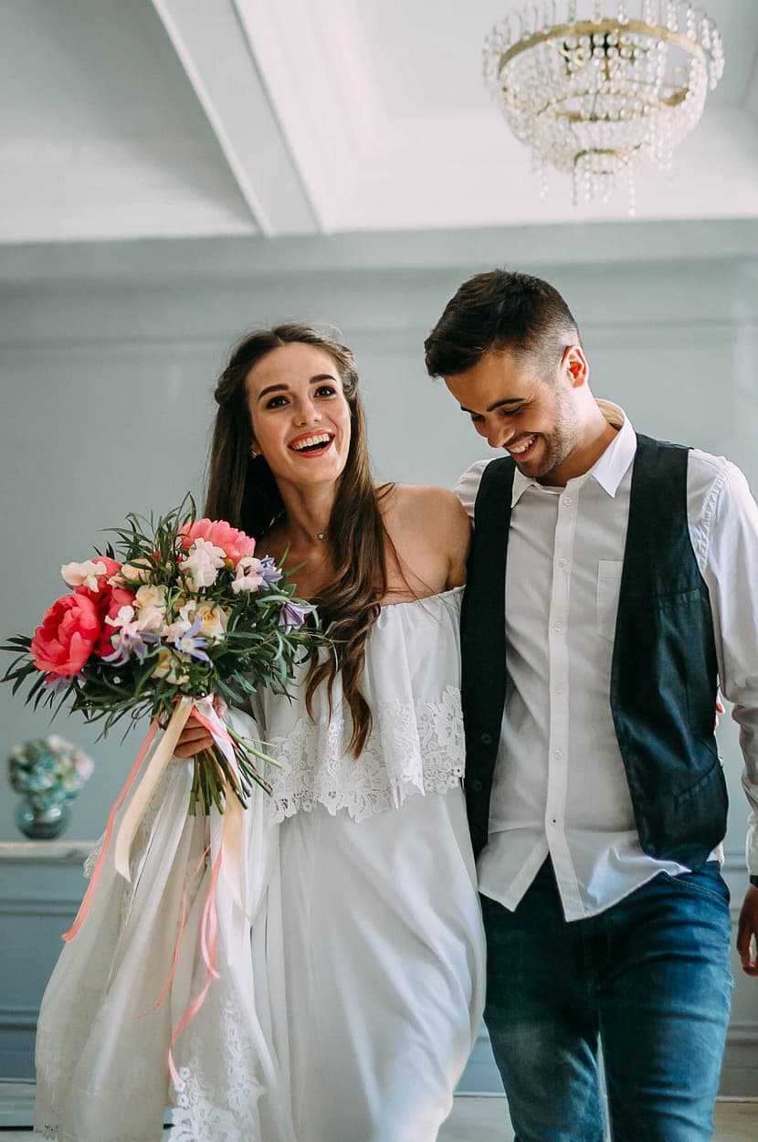 Couple smiling and hugging after their wedding