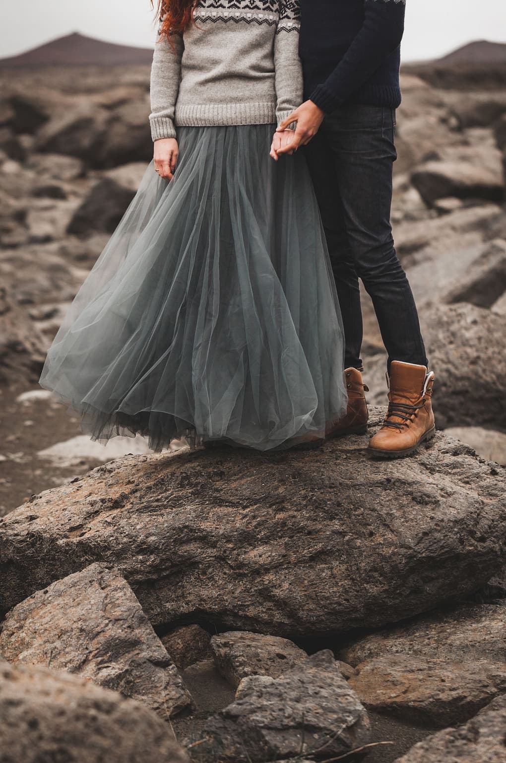 Couple smiles and takes pictures