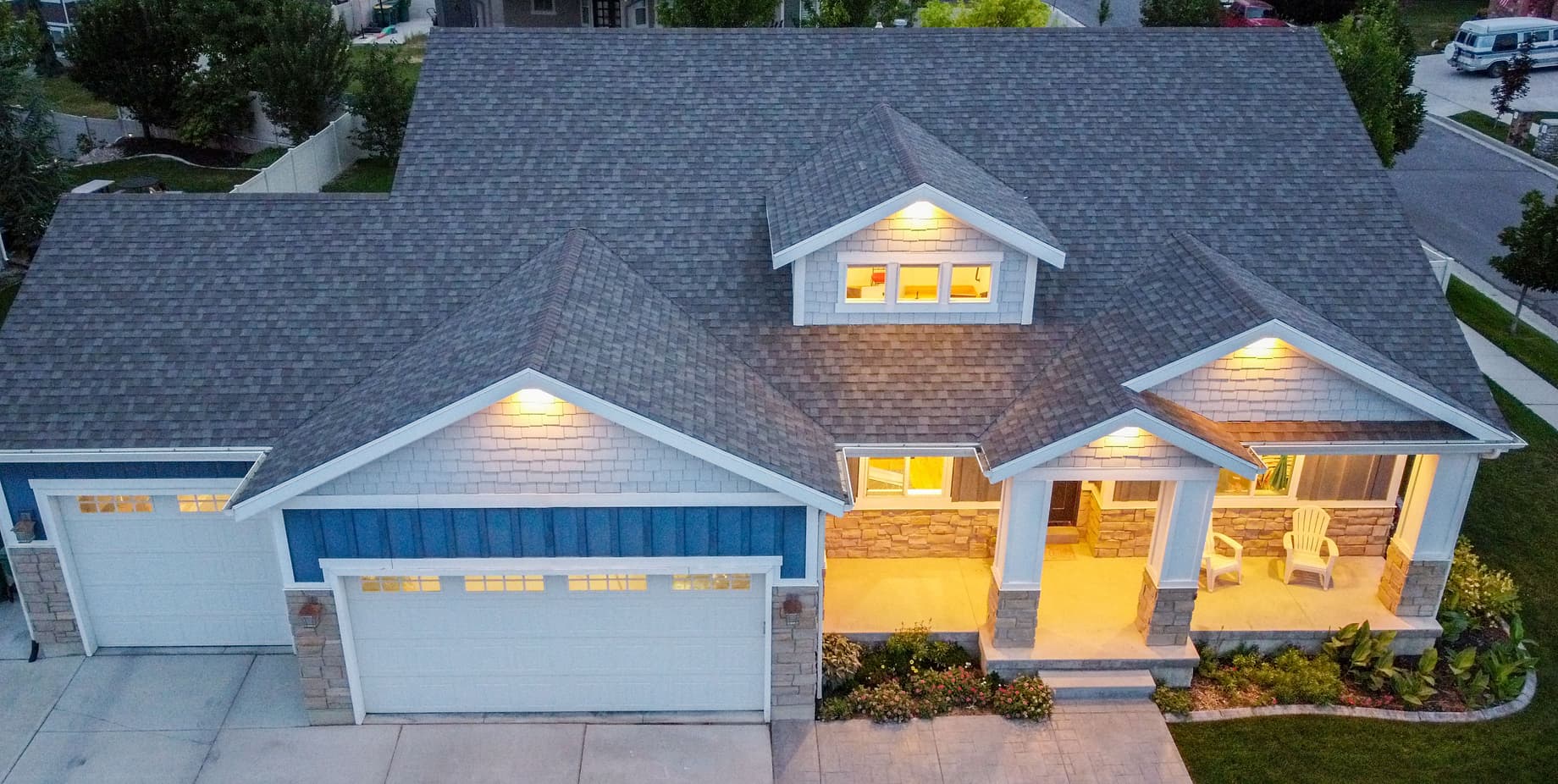 Exterior home with board and batten, beach shingles, and stone