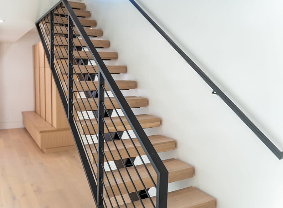 Open, modern and floating staircase with steel railings of Salt Lake City custom home featured in the Salt Lake City Parade of Homes.