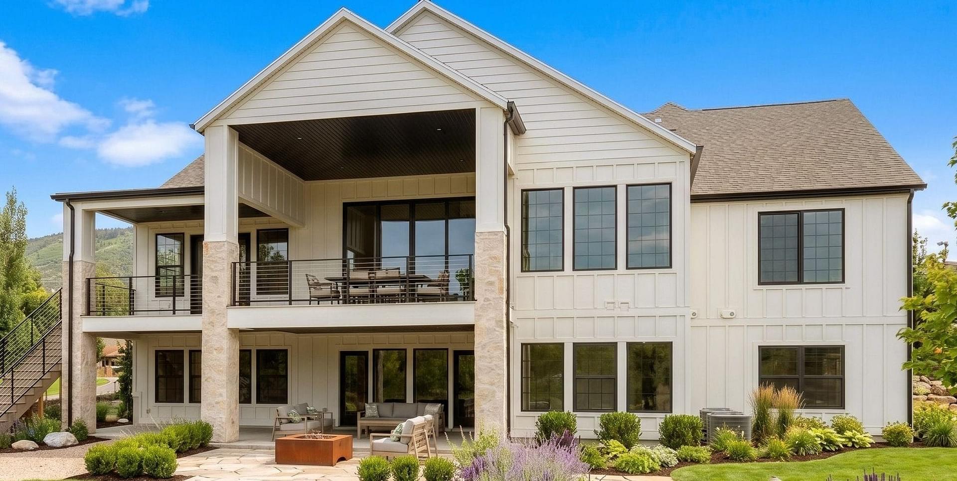 Exterior home with board and batten, beach shingles, and stone