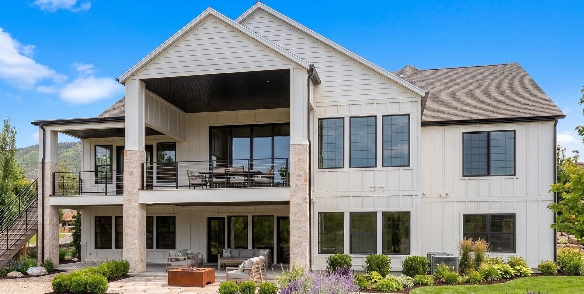 Rear exterior with covered patio at the Springbrook custom home in Midway, Utah
