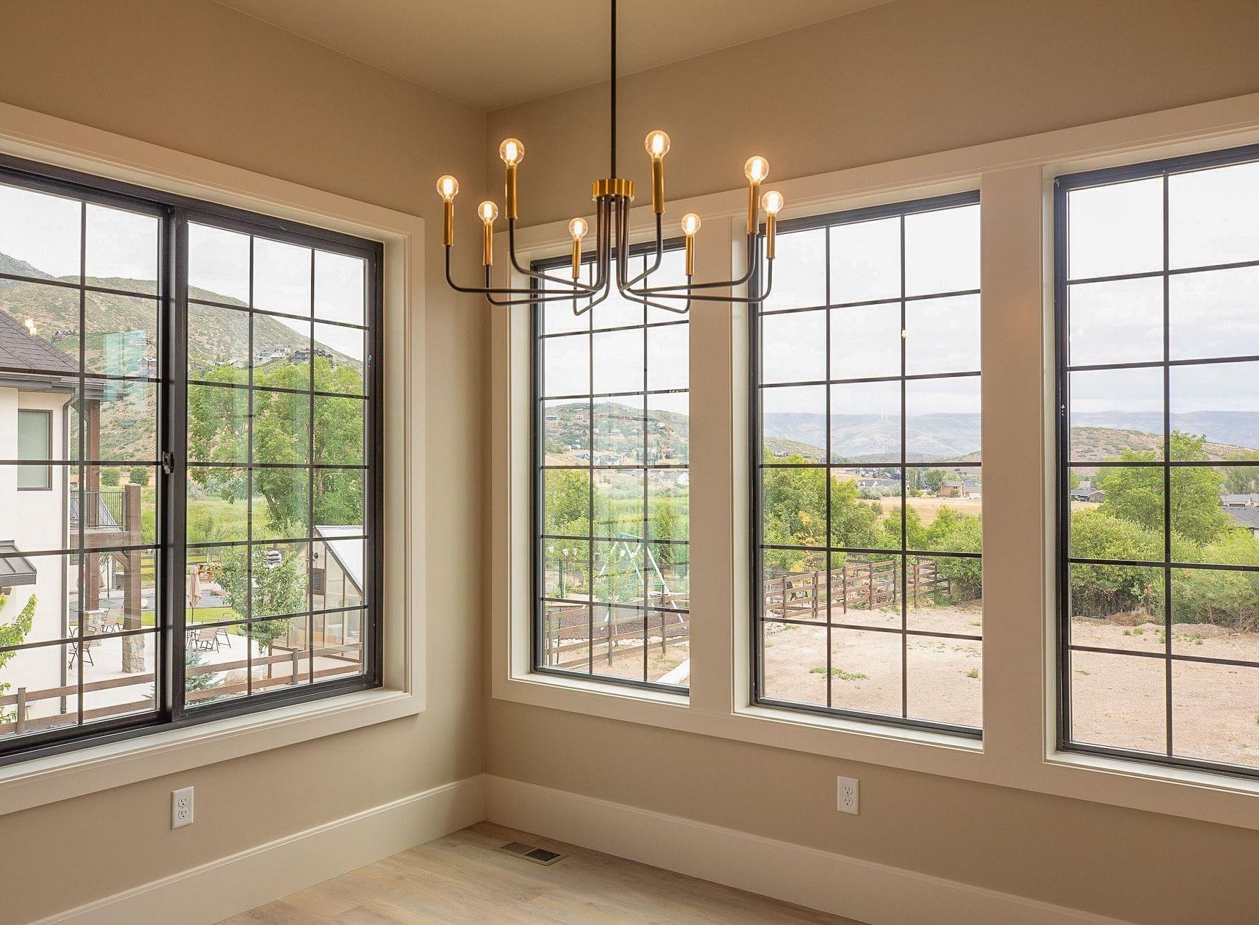 Dining area with mountain views in the Springbrook custom home in Midway, Utah