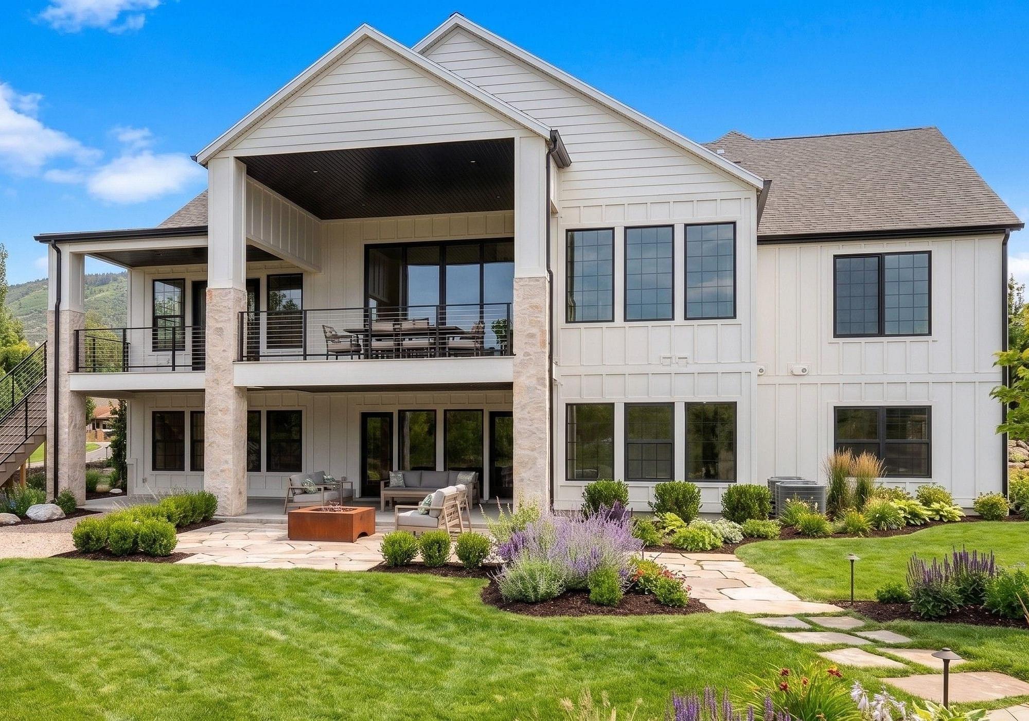  Rear exterior with covered patio at the Springbrook custom home in Midway, Utah 