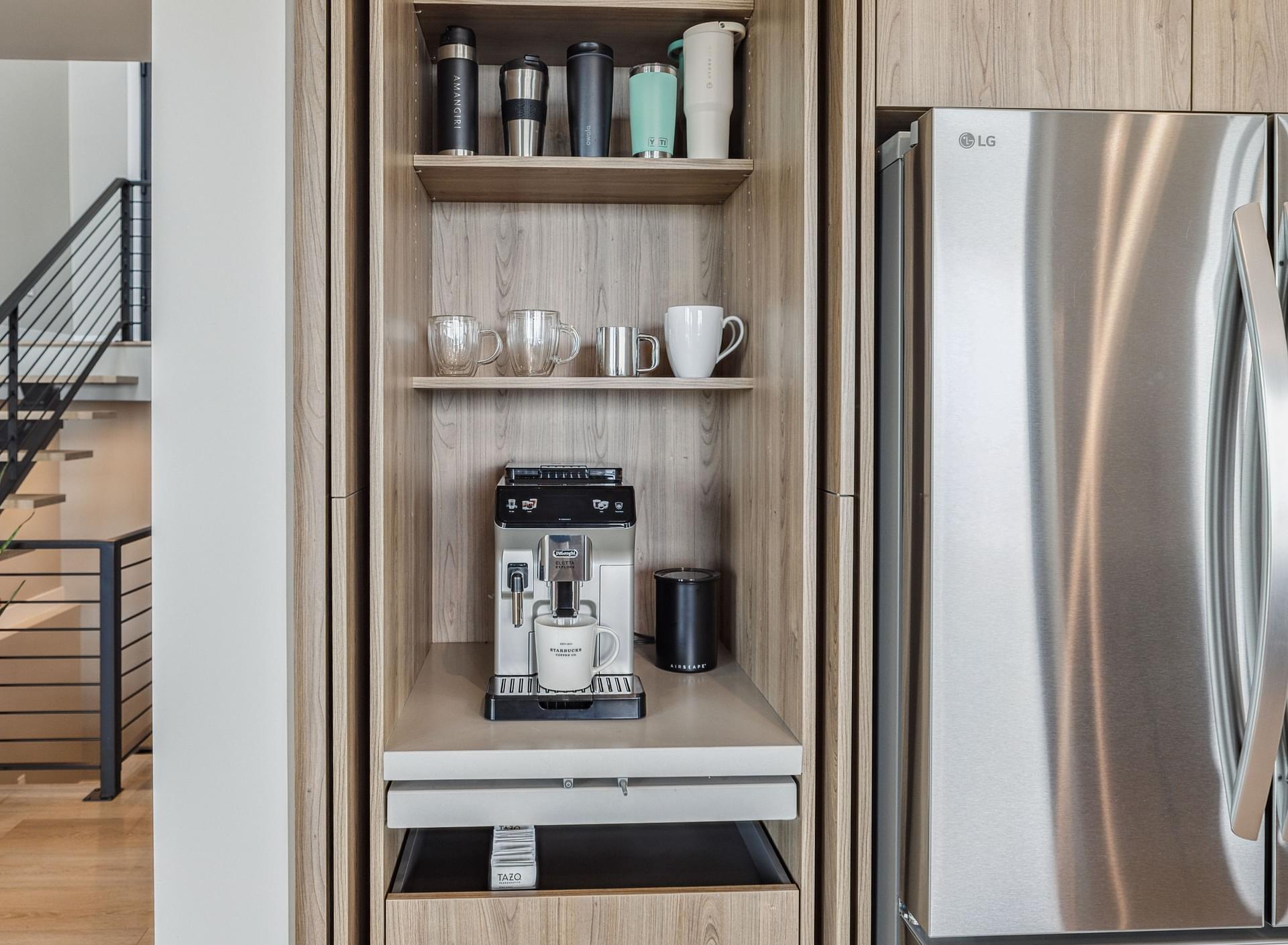 Built-in and hidden coffee bar with open shelving and wood cabinetry.