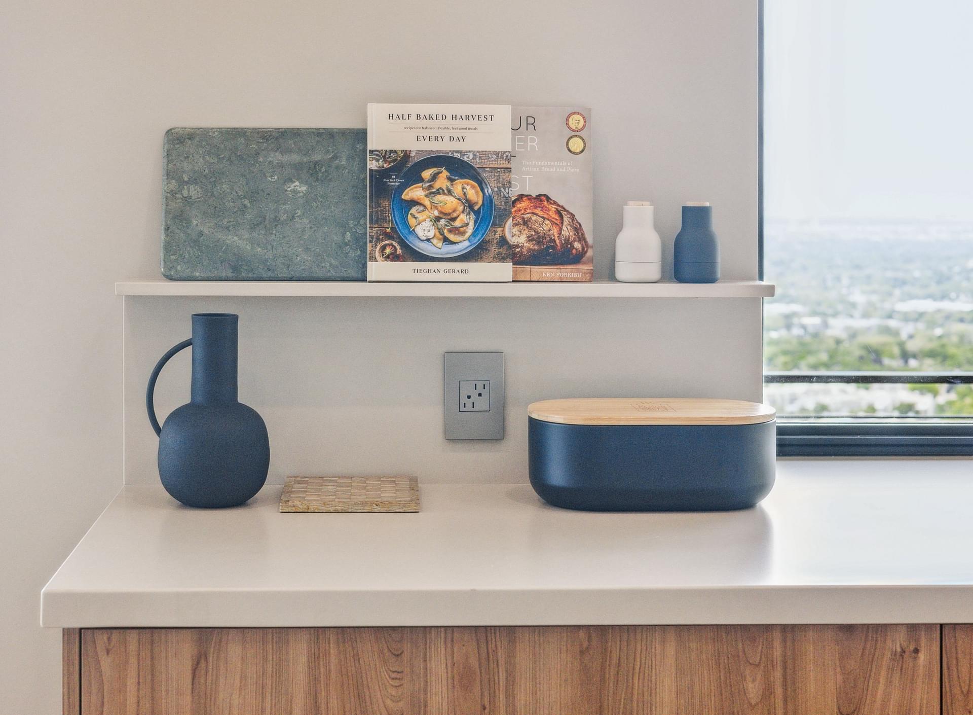 Floating shelves and custom cabinetry with decorative accents.