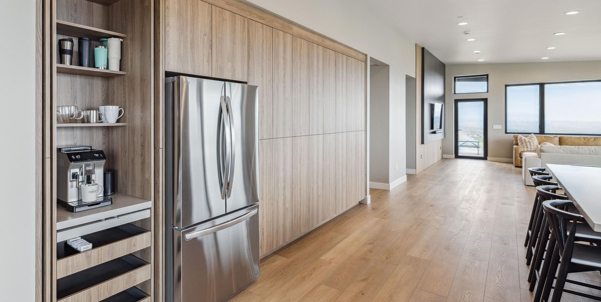 Open-concept kitchen with large island and custom cabinetry in the East Bench residence of Salt Lake City.
