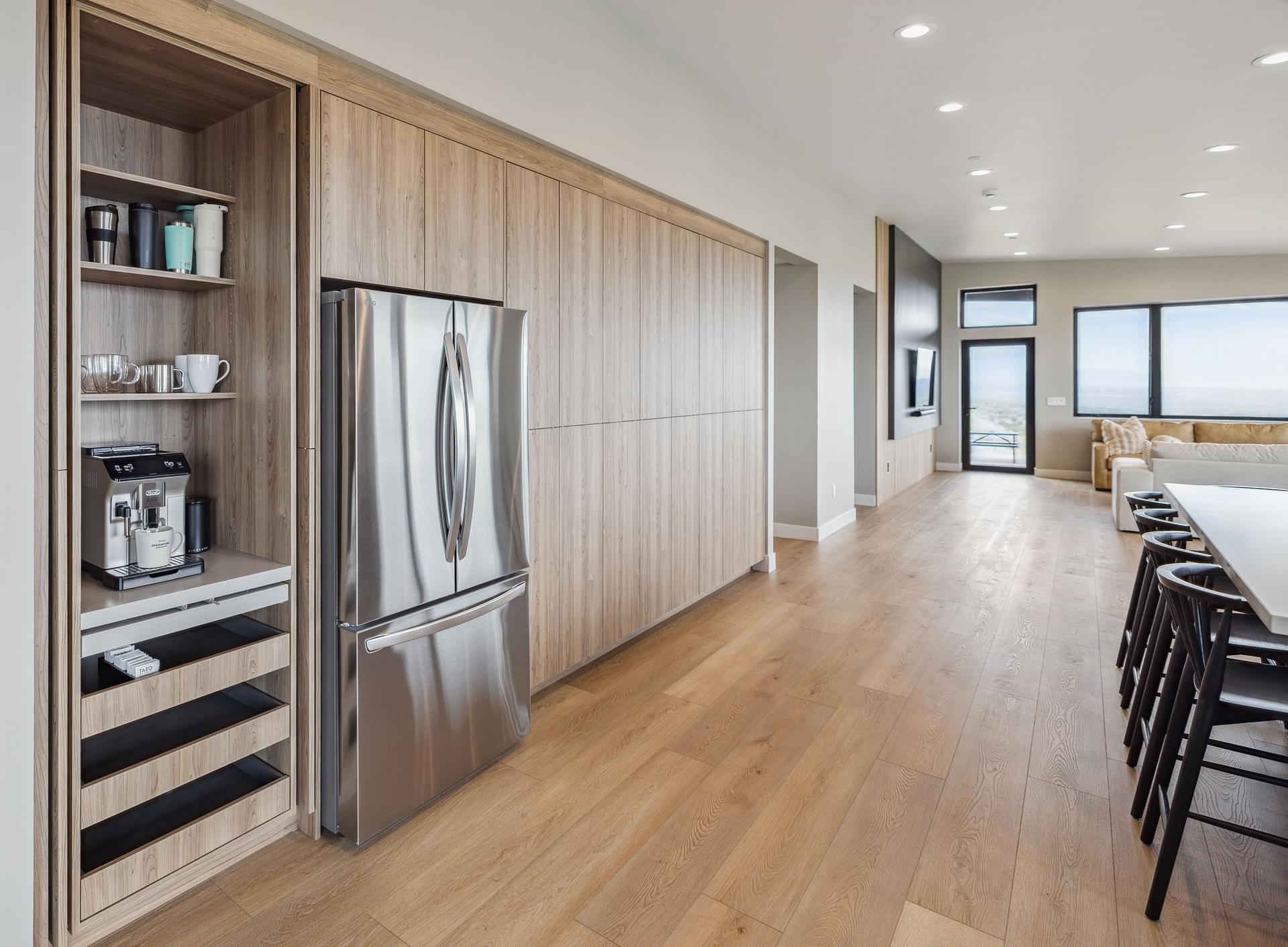 Open-concept kitchen with large island and custom cabinetry in the East Bench residence of Salt Lake City.