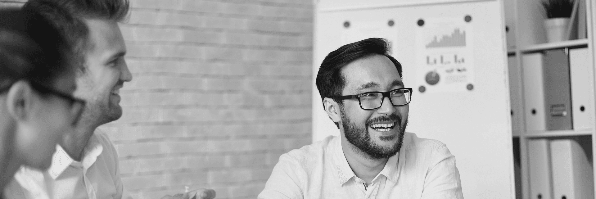 Male employee smiling in office