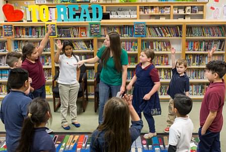  A teacher leading a circle of students in a discussion 