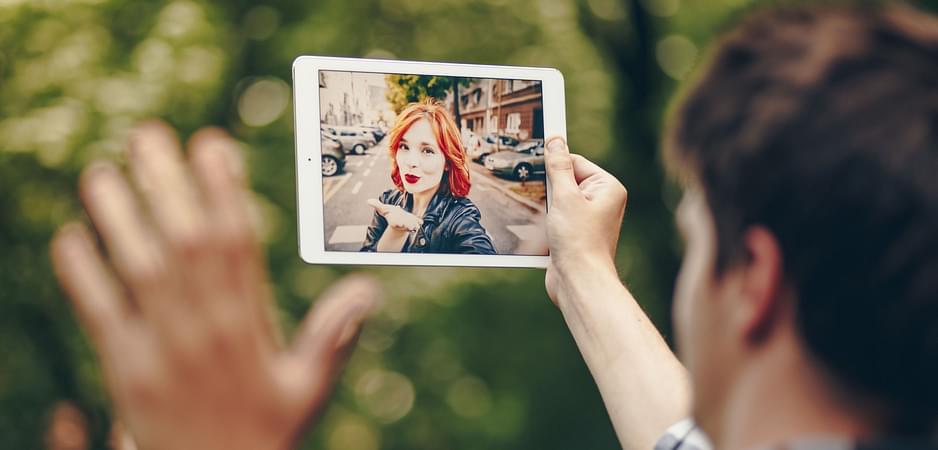 A couple talks via video call