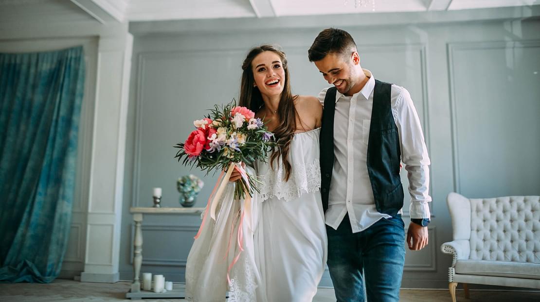  A couple smiling on their wedding day 