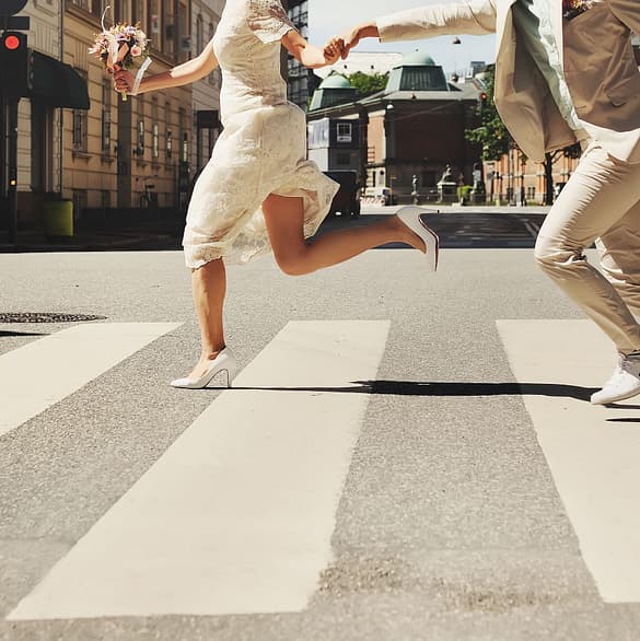 Married couple crossing street