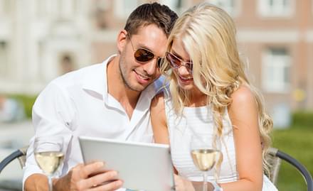 Couple looking at a tablet together