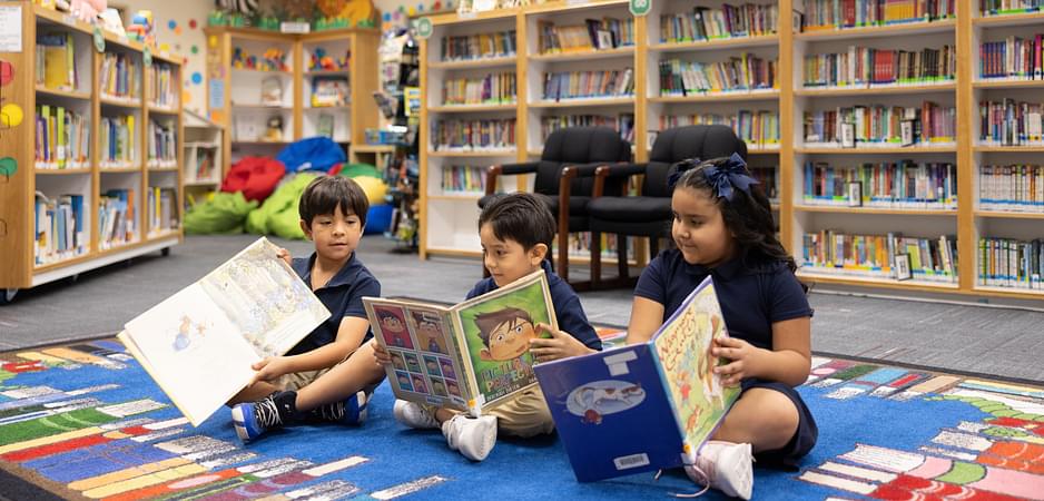 Three children in the library